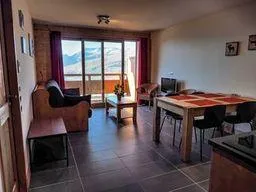 Spacious lounge area with amazing view across the valley both in summer and winter