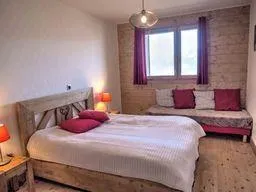 Comfortable double bedroom with extra single bed.