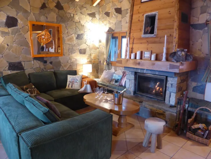 The living room. In the Savoyard spirit with stone, wood and the fireplace with insert