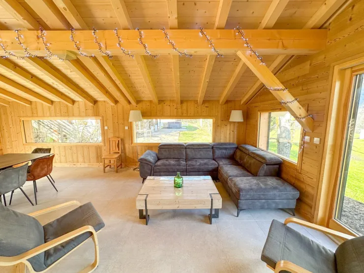 Large, bright living room opening onto the outside.