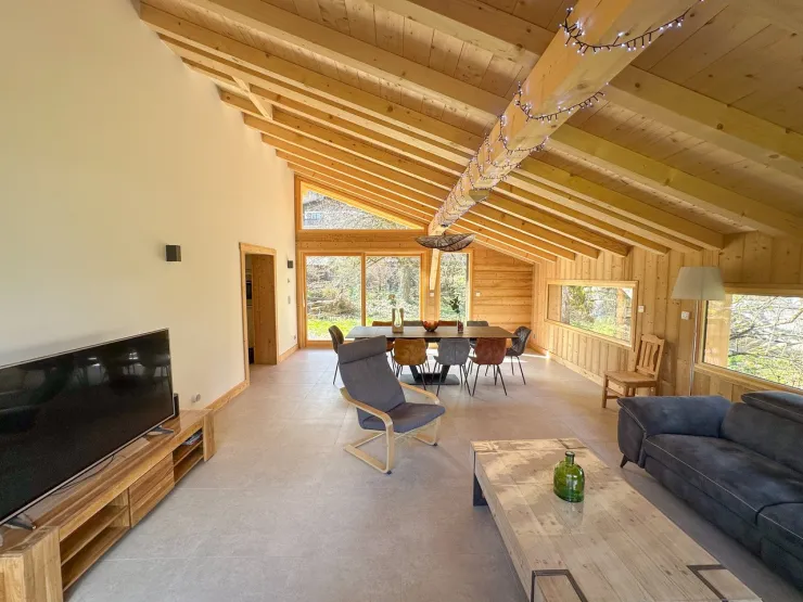 Large, bright living room opening onto the outside.