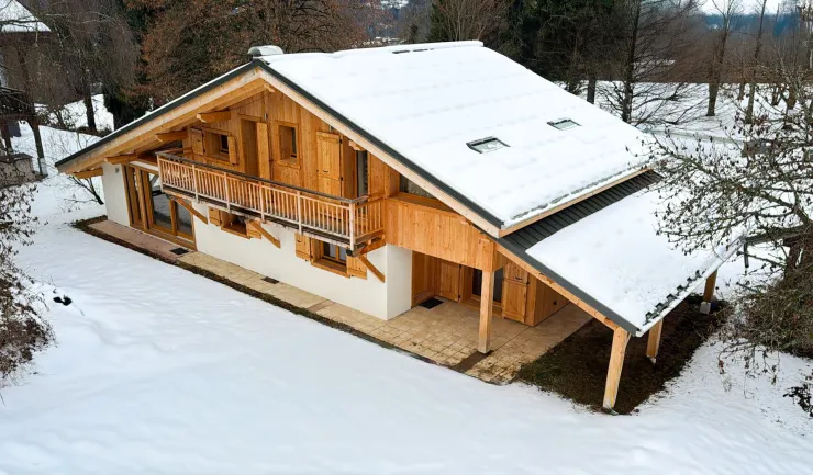 Exterior view of the chalet under the snow
