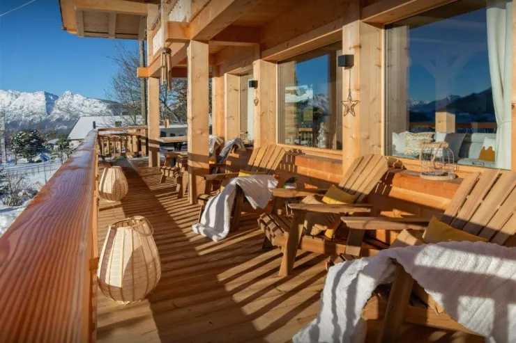 Sun-kissed terrace with panoramic Alpine views. The perfect spot for morning coffee or a relaxing aperitif facing the mountains.