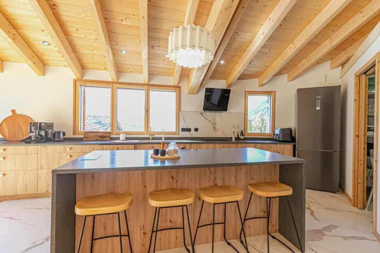Kitchen with a welcoming island and adjoining pantry