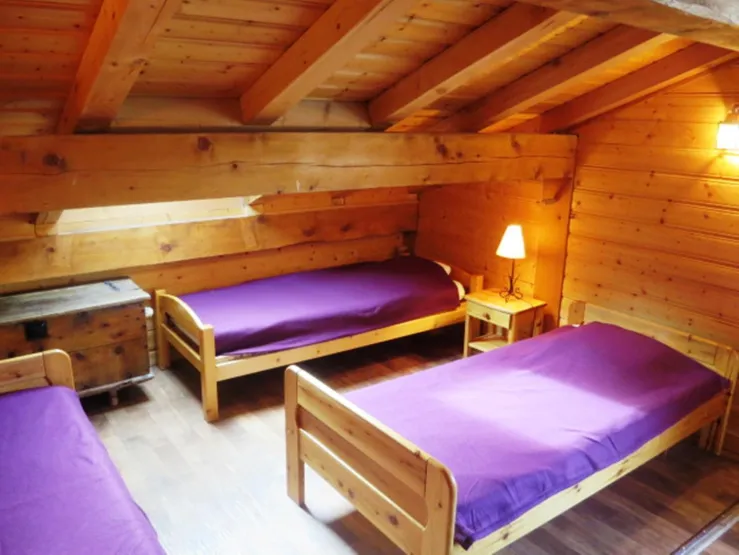 Bedroom with three beds