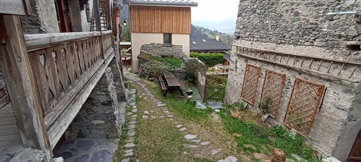 outdoor view small garden with tables and BBQ