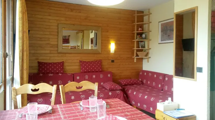 Living room with two sofa beds, mirrors