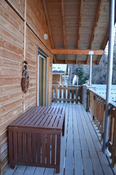 Terrace adjacent to the lounge(show) with furniture of outside.