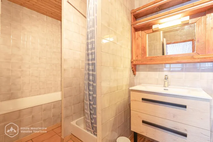 bathroom with bath and shower
