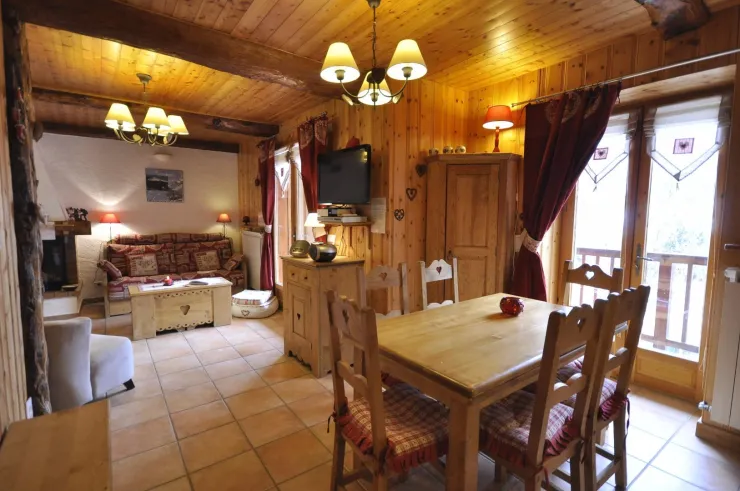 lounge and dinner room with with wall and directional TV