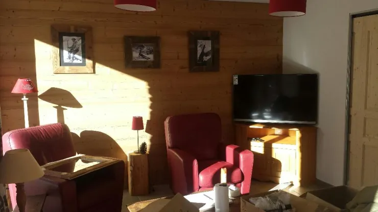 Living room with armchairs and sofa bed