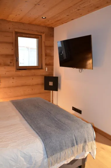 Wall-mounted TV in the master bedroom